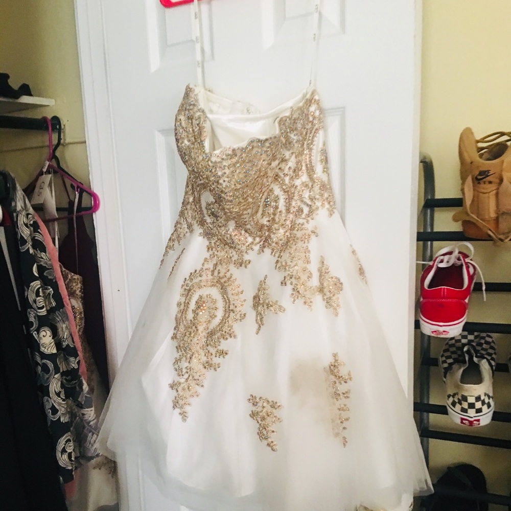 White and gold sleeveless dress with rhinestones